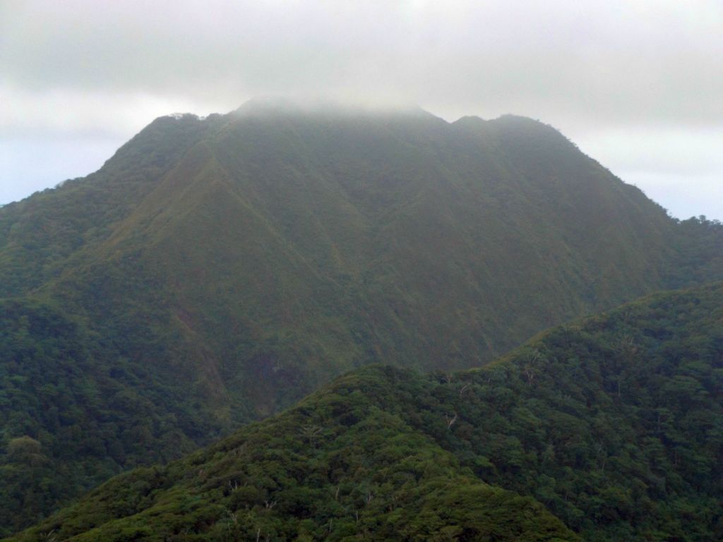 Zooming in on the background ridge, which contains Matafao Peak (obscured by clouds), the highest point on Tutuila: