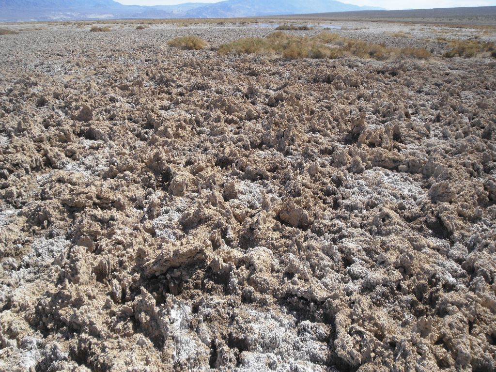 Here we are walking across some jagged rocky salt formations to reach the first pond: