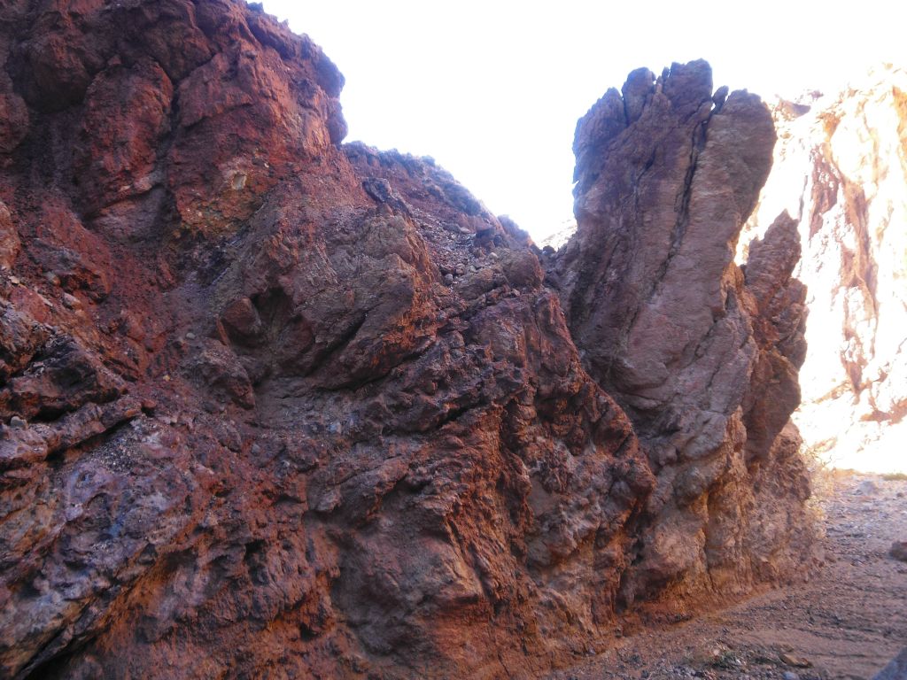 A uniquely shaped rock sticking out of the canyon wall: