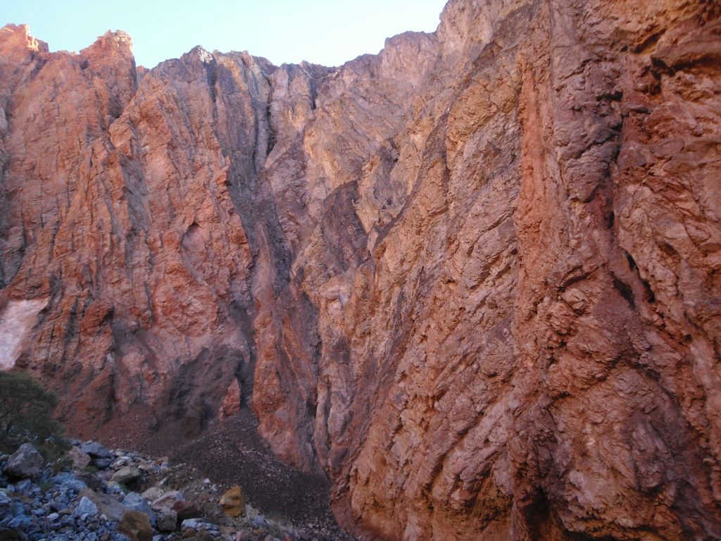 The canyon walls and cliffs above continued to remain quite high.  Notice here the texture and shape of the rock surface of the walls: