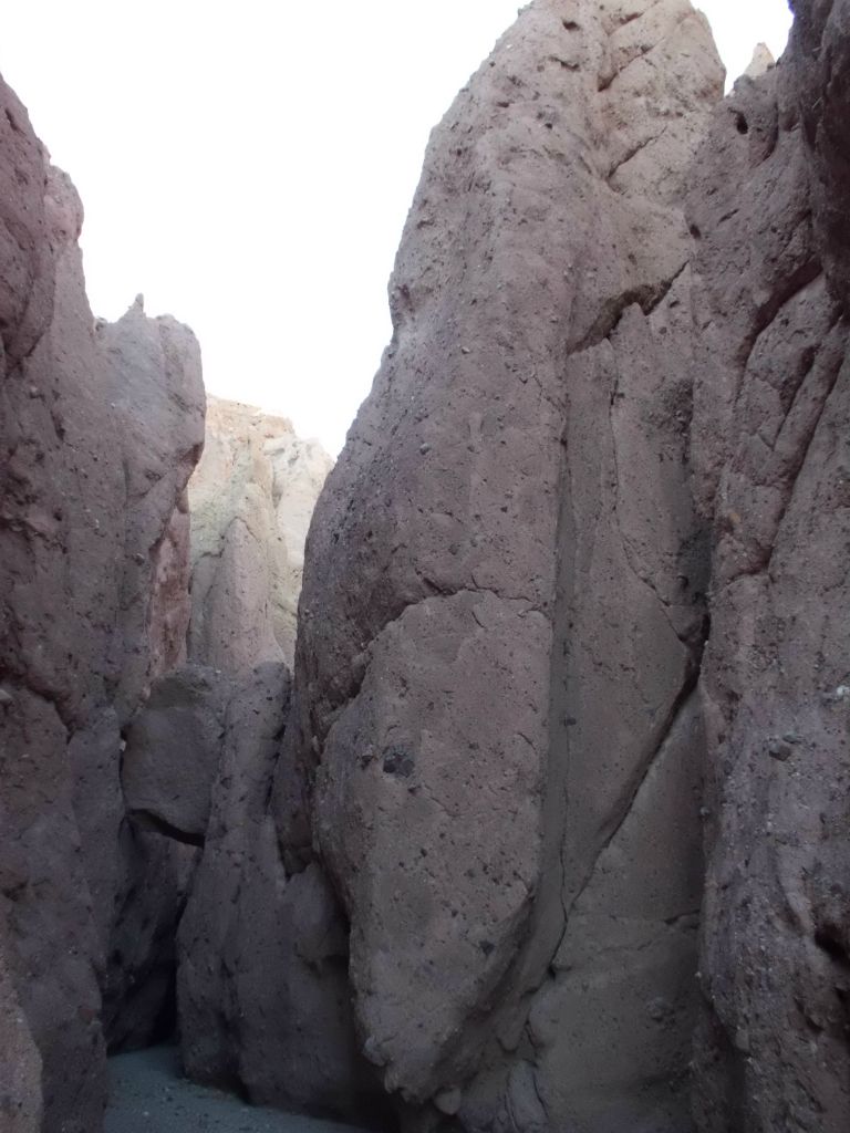 A towering rock wall stands tall in the narrows: