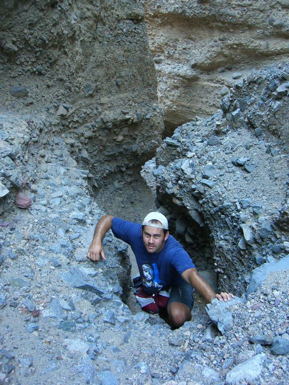 Steve climbing the dry fall in order to continue: