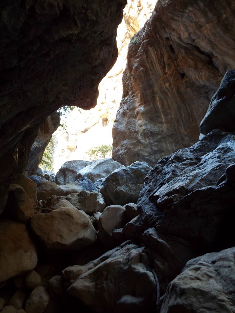 Climbing through a boulder-filled narrow passage: