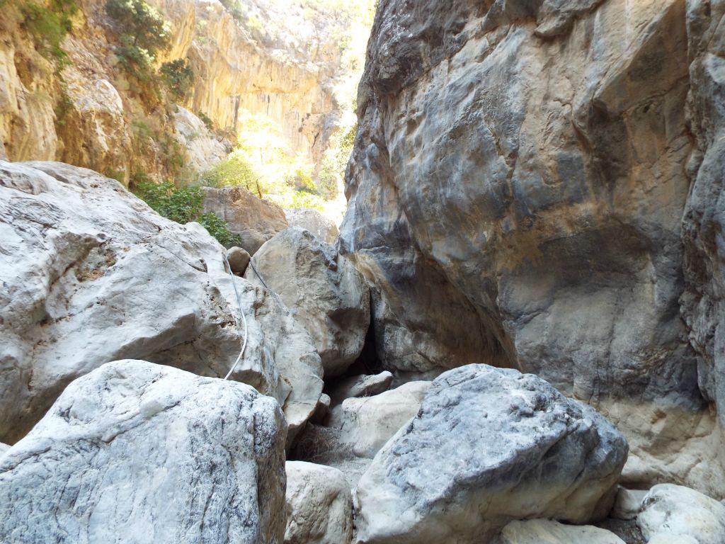 Two pictures showing the continuous challenges while hiking.  This shows a typical boulder climb: