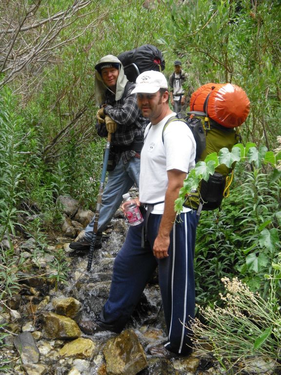 This picture was taken on the hike back down, but it is presented in the order which would be seen hiking up canyon.  Look closely at our feet in this picture, and you will understand one of the secrets of progressing up canyon: