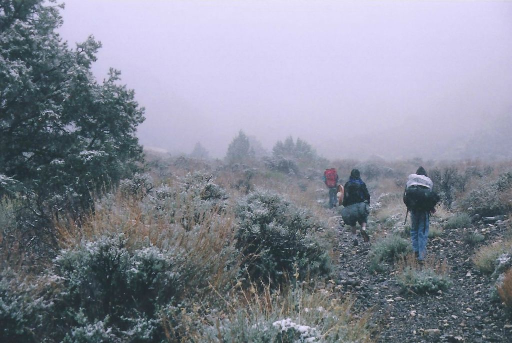 Josh, Rob, and Silva backpacking out through the falling snow on our 1st trip: