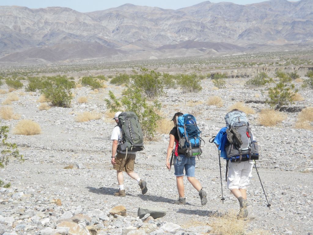 Shawn, Senta, and Kathy backpacking around the first hillside: