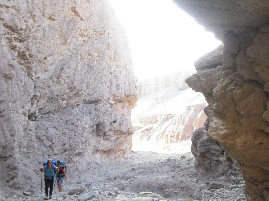 Two of our backpackers walking through the early narrows toward the dry fall: