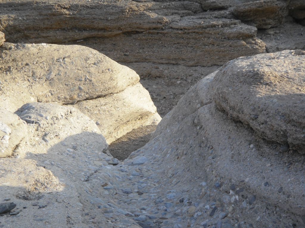 A mixture of breccia rock and conglomerate rock much like natural concrete dominated through Indian Pass Canyon on a scale I had never seen before.  It was literally everywhere and that made the walking quite nice: