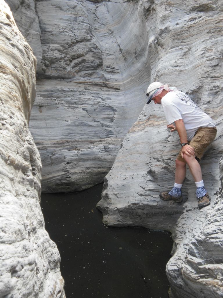 Shawn looking down at the legendary main Plunge Pool of Indian Pass Canyon: