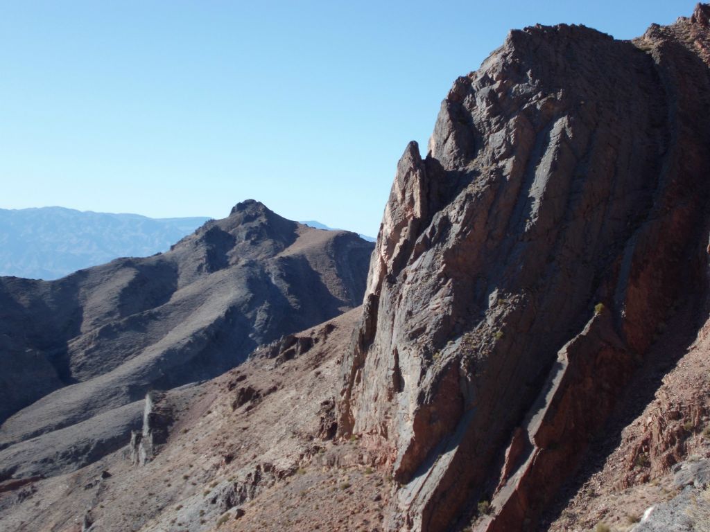 A massive slab of rock rises up out of the hillside nearby: