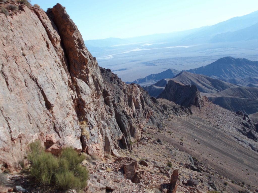 Once we got below the endless rock wall you see pictured here (after some backtracking), we followed the base of the wall towards the saddle: