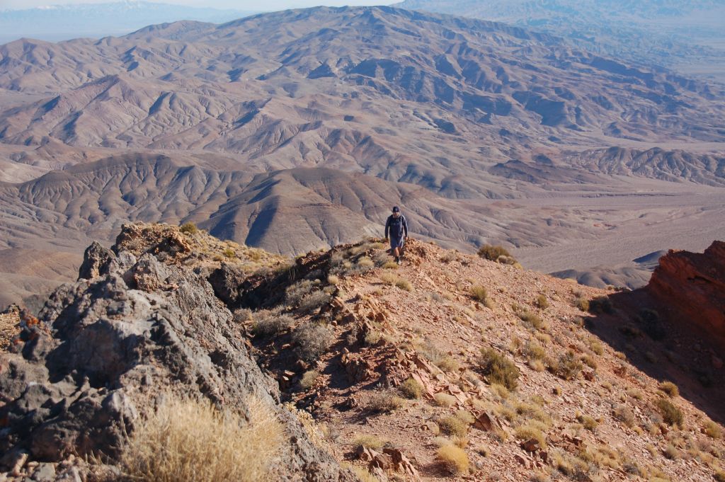 Two pictures of Steve as he arrives on the summit of Corkscrew Peak for the first time, after driving by it for nearly 15 years: