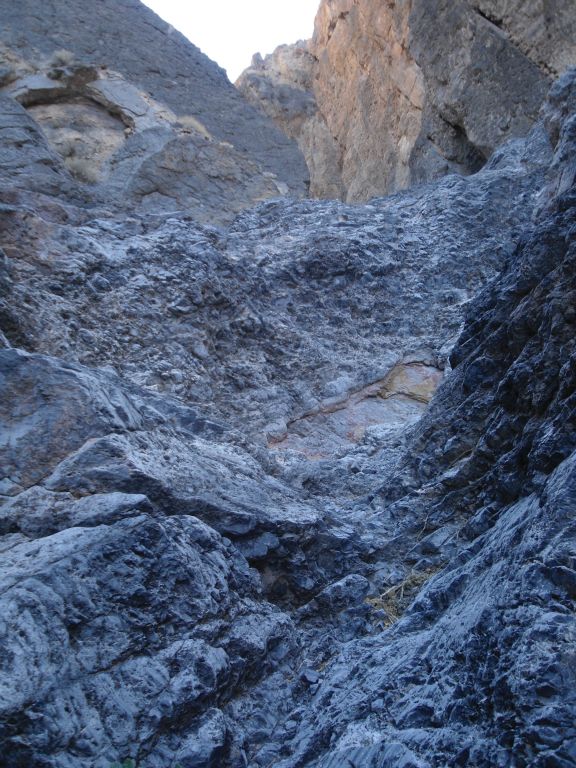 Climbing some simple dry falls with rough, sharp texture: