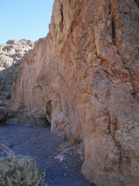 Turning a corner as the high walls keep us in the shade: