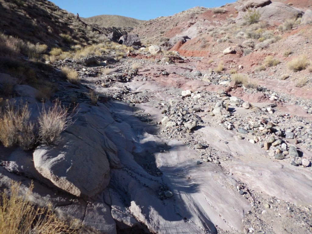 Hiking through a polished rock floor in the wash: