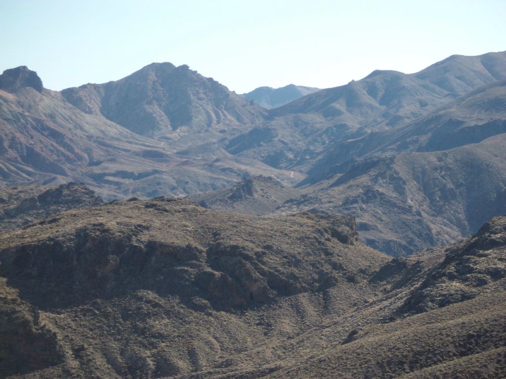 Arriving at the saddle and looking back towards Red Pass far in the distance: