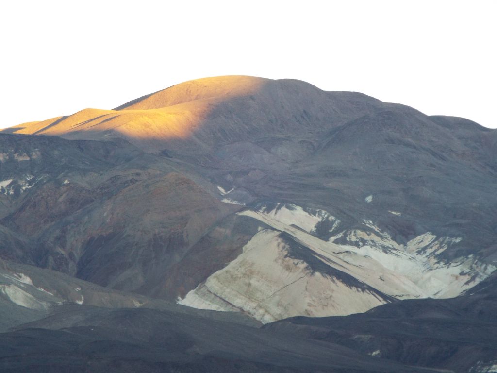 The sun's first light on Saline Peak above Chalk Canyon: