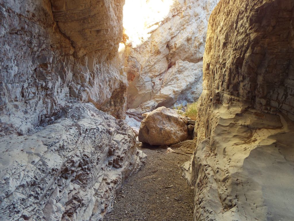 A small boulder has fallen into the middle of the wash: