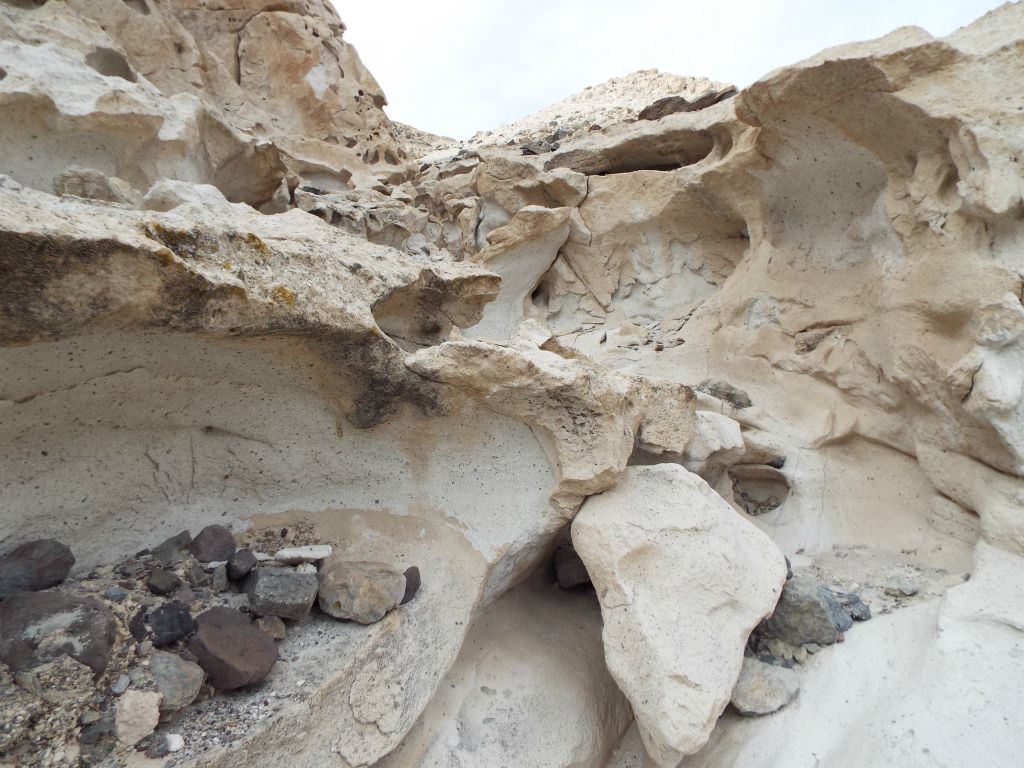 Off to the left, we spotted the beginning of a slot canyon which cut into the tafoni walls: