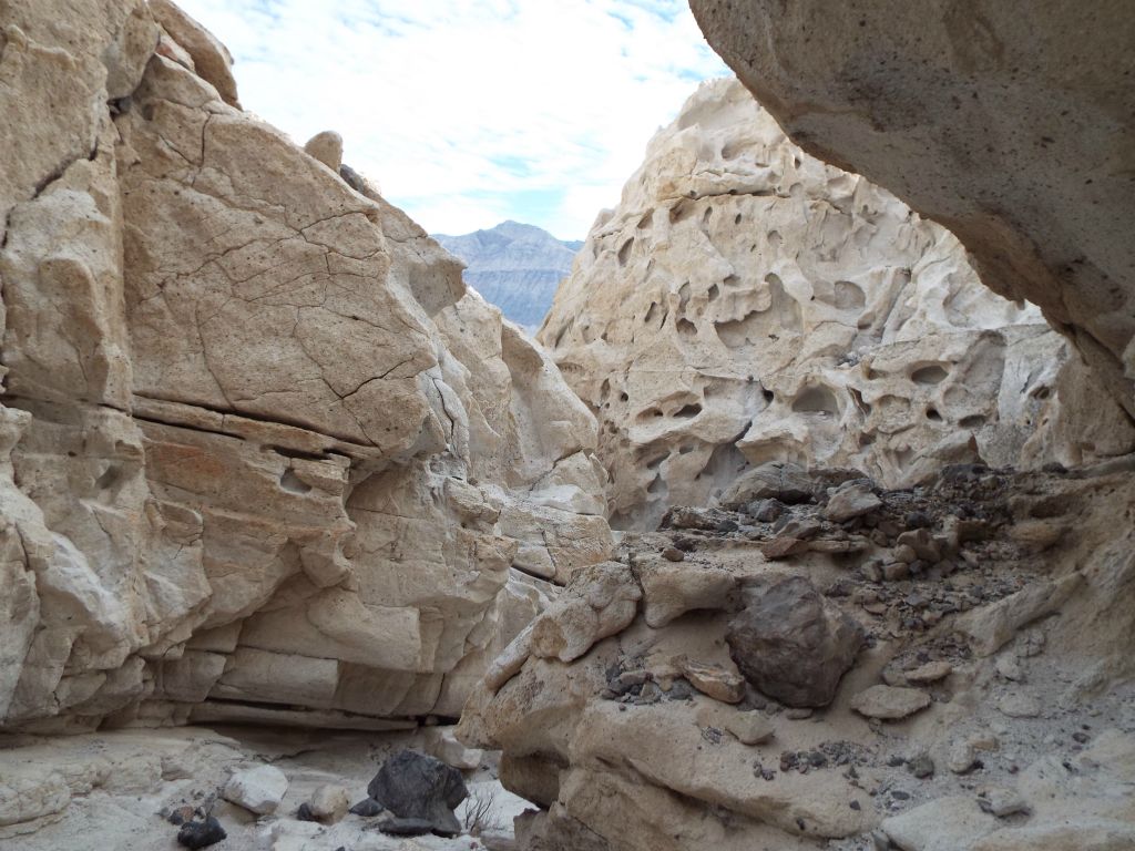 Here we have an overhang, a rare flatter section of wall, and more tafoni weathering: