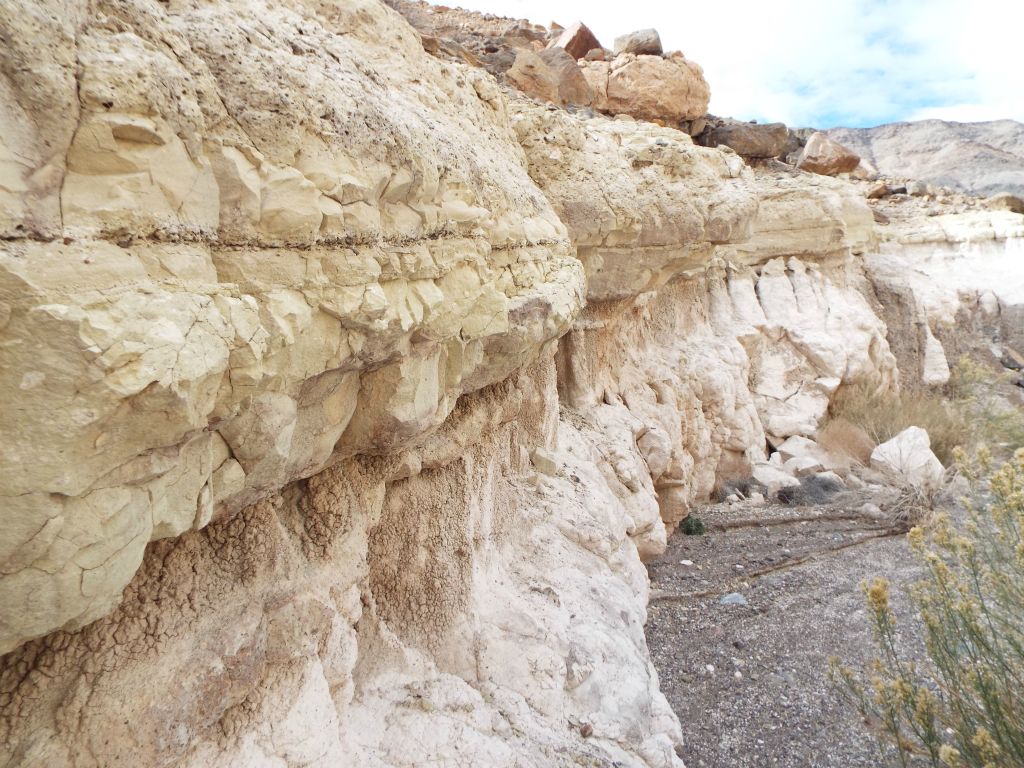 These walls have a very rough composition with boulders above ready to roll down into the wash: