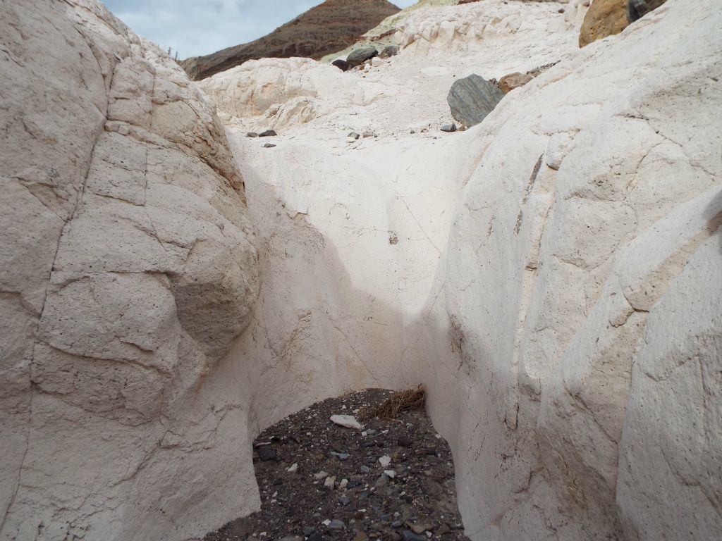 A small pretty dry fall which matches the surrounding color and texture of the canyon walls: