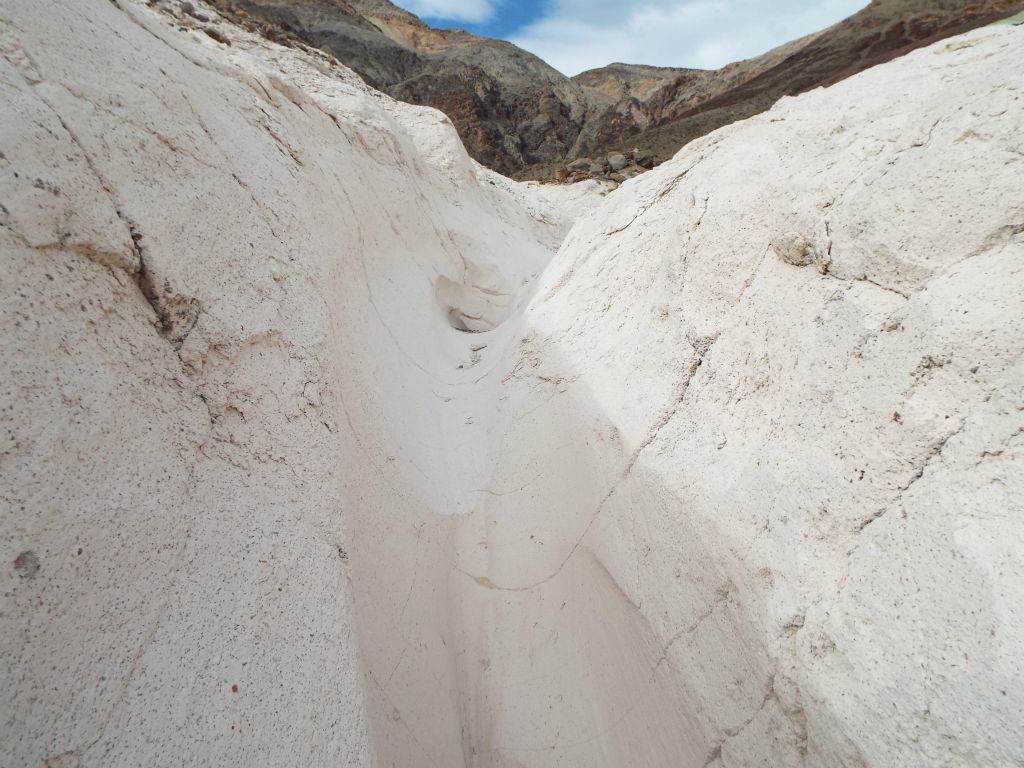 Hiking in narrow trenches similar to Indian Pass Canyon, except these have the white "chalk" rock instead of breccia: