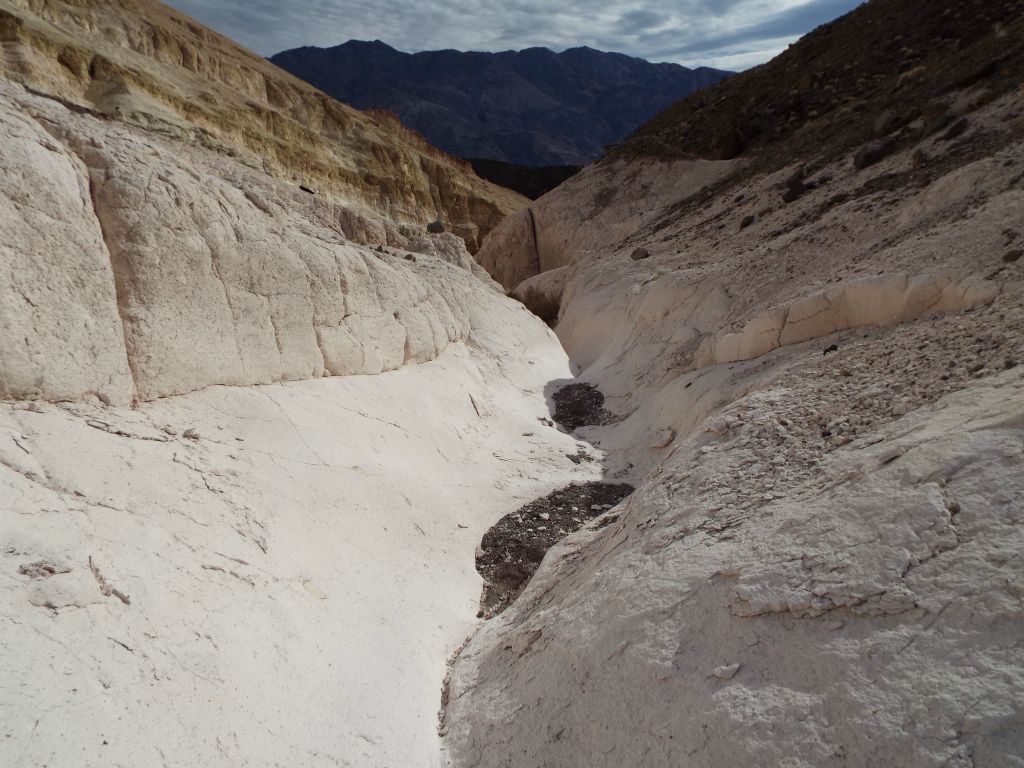 Heading back down the side canyon through narrow trenches of white: