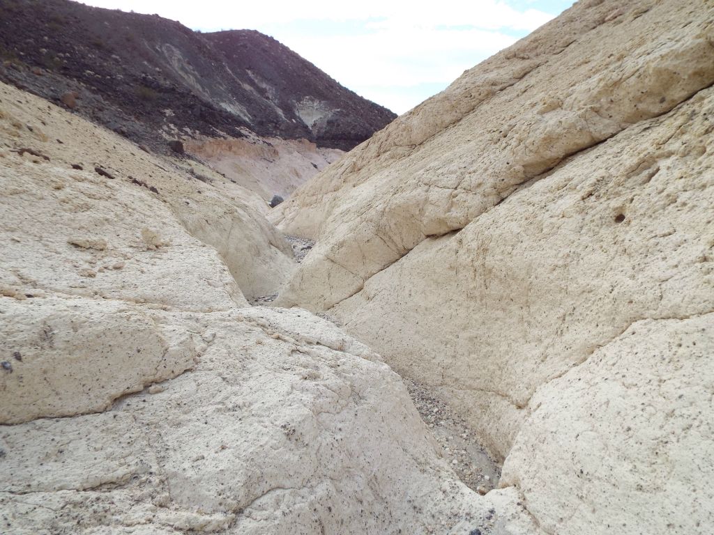 The main canyon hiking resumed with an area of narrow trenches covered in white: