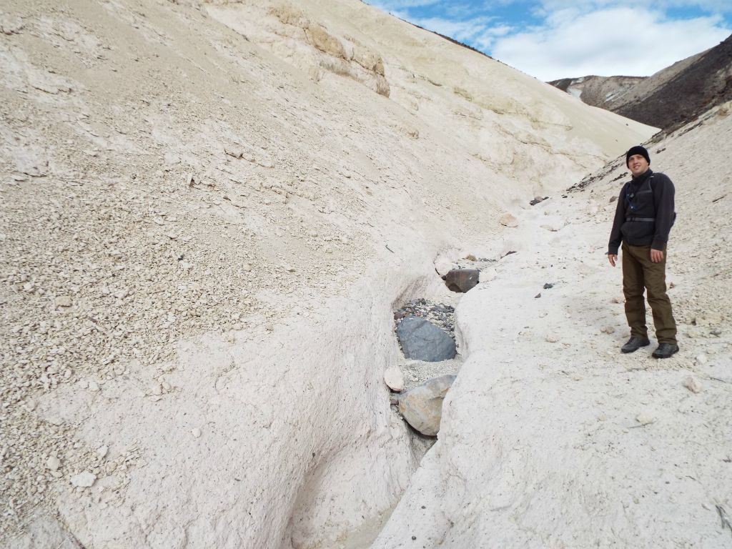 Tobin standing at an area where the canyon mostly disappeared and it was simply the merging of two hillsides: