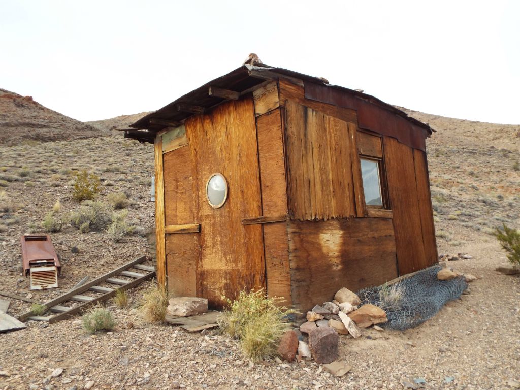 The front side of the cabin has a window facing the old road: