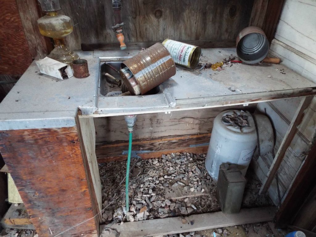 Notice the sink and hoses that are hooked up.  I'm not sure where this cabin managed to get water from: