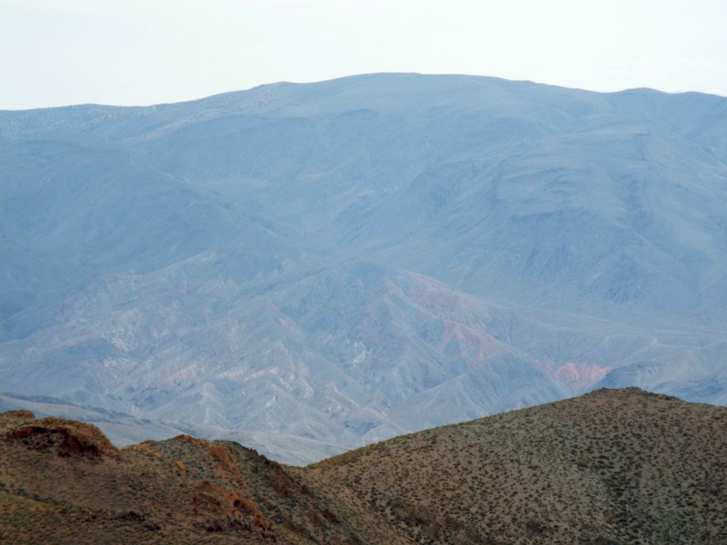 Zooming in on the flat rounded summit of 7,508 foot Pinto Peak: