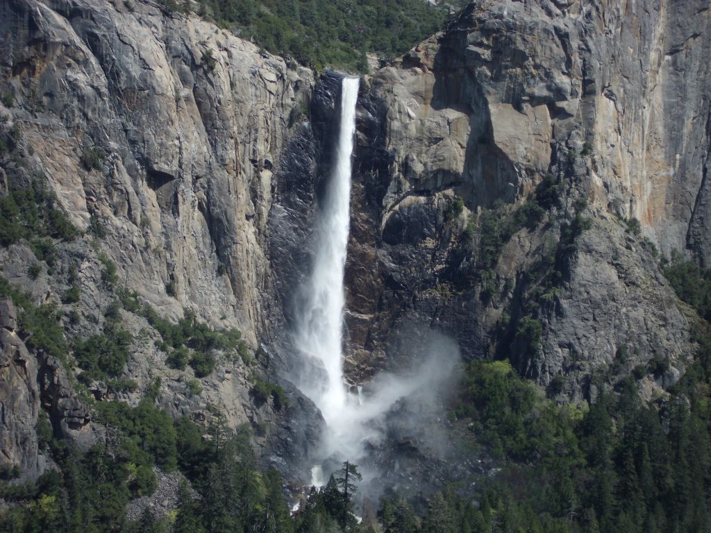 Another view of Bridalveil Fall showing the wind blowing the water and mist around: