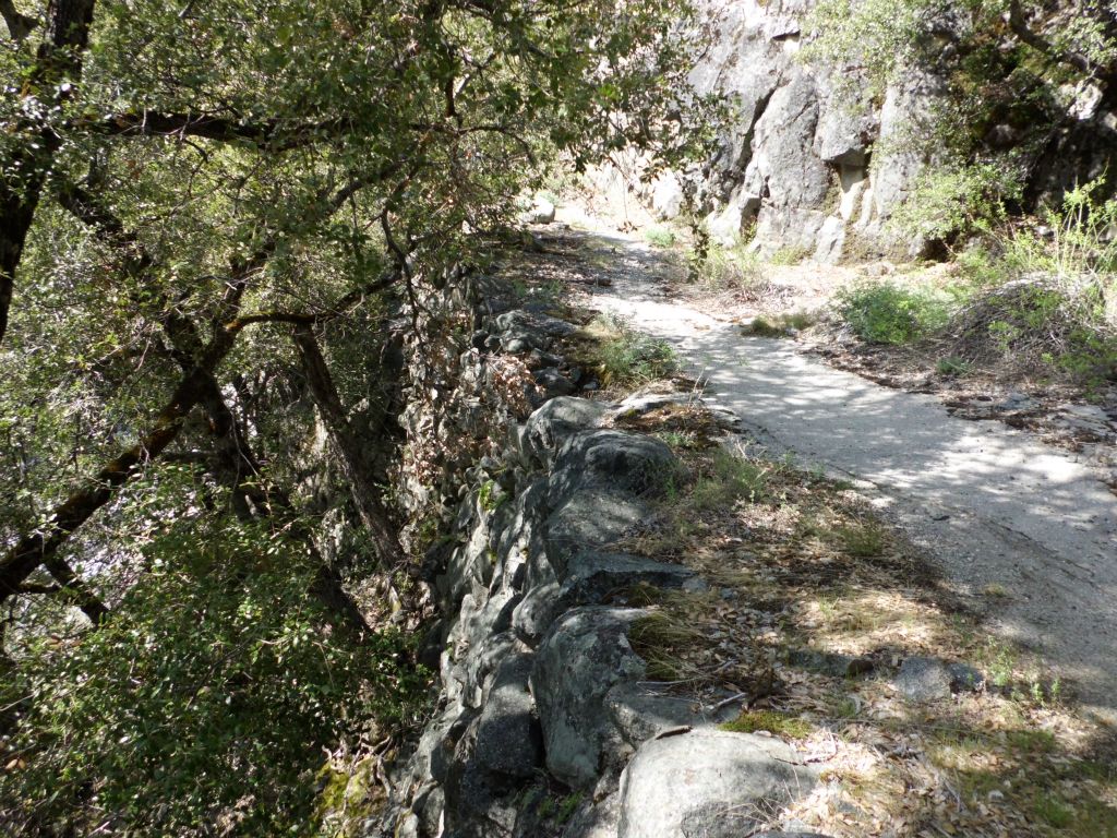 The rock wall of the old road can be seen here still doing its job: