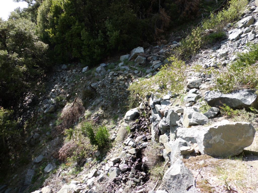 This major washout can be clearly identified because there is a pipe below the trail which drains water.  You can see the pipe if you look carefully near the middle wall: