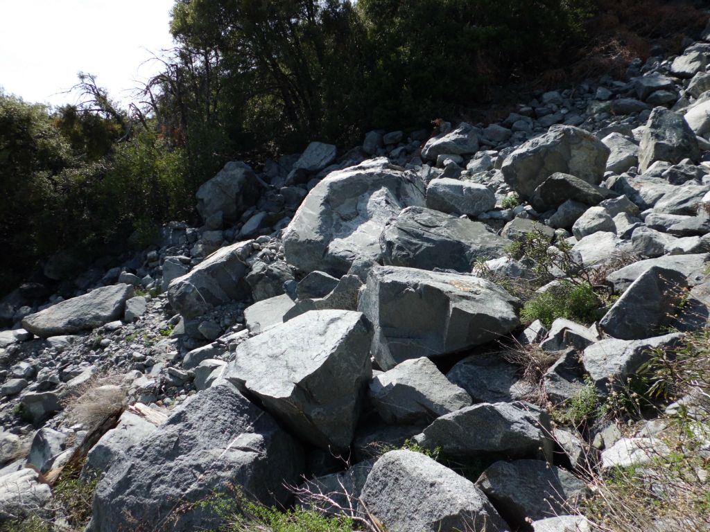 Overcoming a massive boulder field in the next two pictures.  It was areas like this that made the hike challenging and hard to stay on the trail: