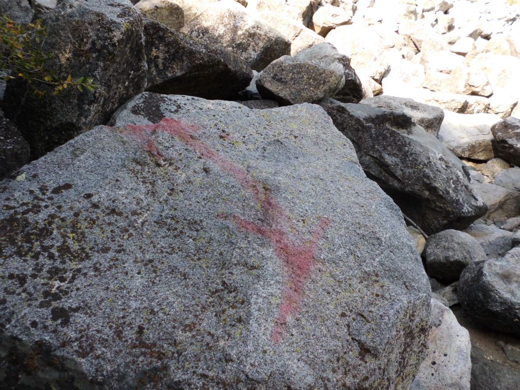 At the forest edge, another double red arrow rock points the way.  An easier way to go from here is to just scramble up the hillside to quickly reach the end of upper switchback: