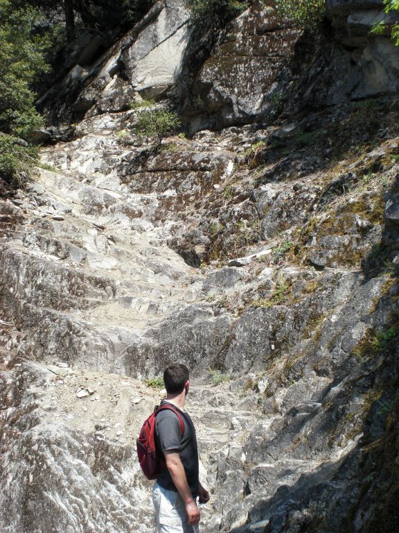 And this was what we saw.  Dave can be seen here looking at the treacherous climb up loose and slippery rock steps: