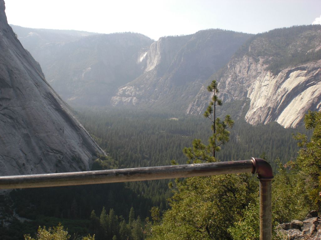 The final view from Sierra Point is to the right and shows the granite slopes leading down from Glacier Point into Yosemite Valley along with distant Yosemite Falls: