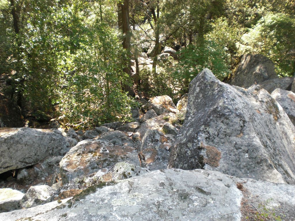 Looking down from the distinct triangular rock back toward the trail to Happy Isles: